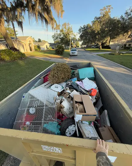 Baus dumpster filled with household junk during a home cleanout