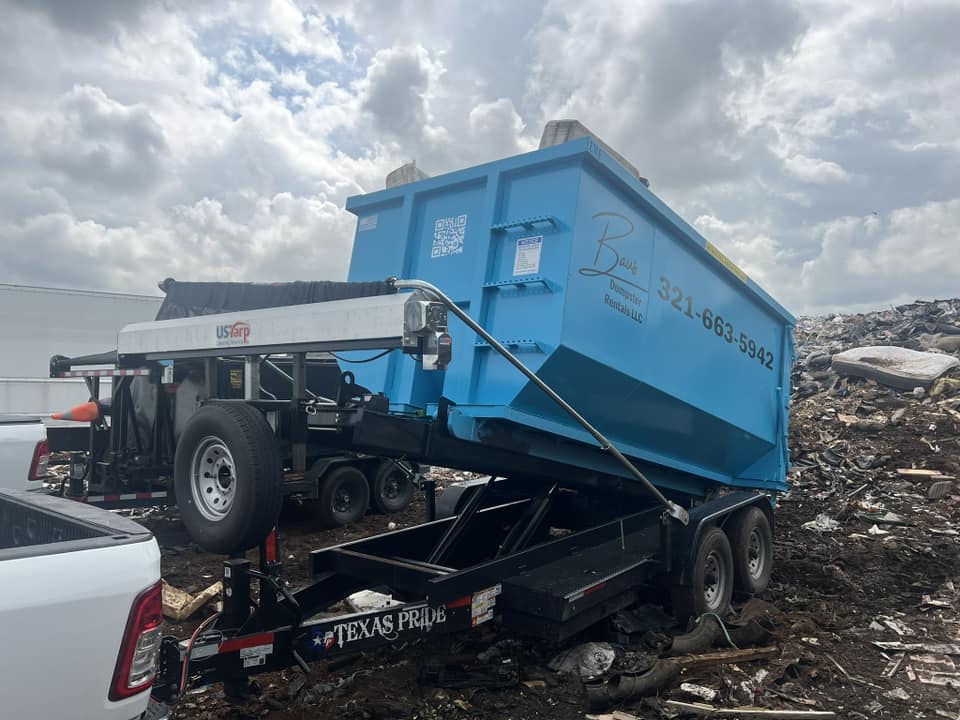 Teal Baus 20 yard roll-off dumpster being delivered in Orlando, FL