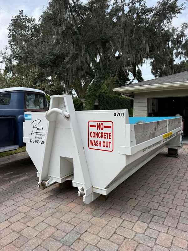 White Baus 7 yard heavy duty dumpster ready for concrete in Windermere, FL