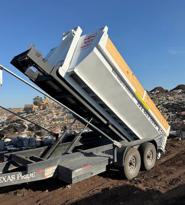 Baus heavy duty dump trailer unloading debris in Orlando, FL